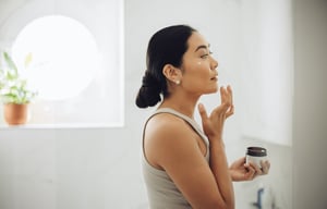 woman-testing-facial-cream